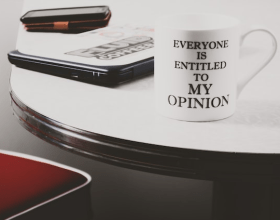 A novelty mug saying, Everyone is entitled to my opinion