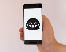 Laughing face emoji on a smartphone